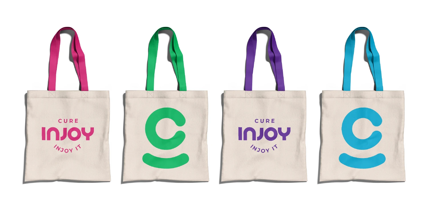 Four canvas Cure Injoy tote bags